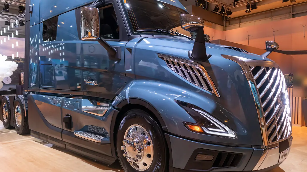 New-generation Volvo VNL 860 sleeper tractor in blue, front three-quarter view